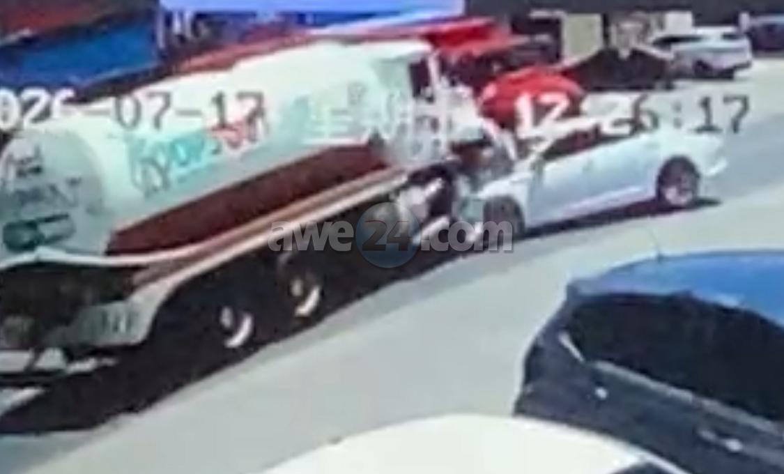 Car Swerves Into Oncoming Truck After Failed Attempt to Pass Parked Vehicle