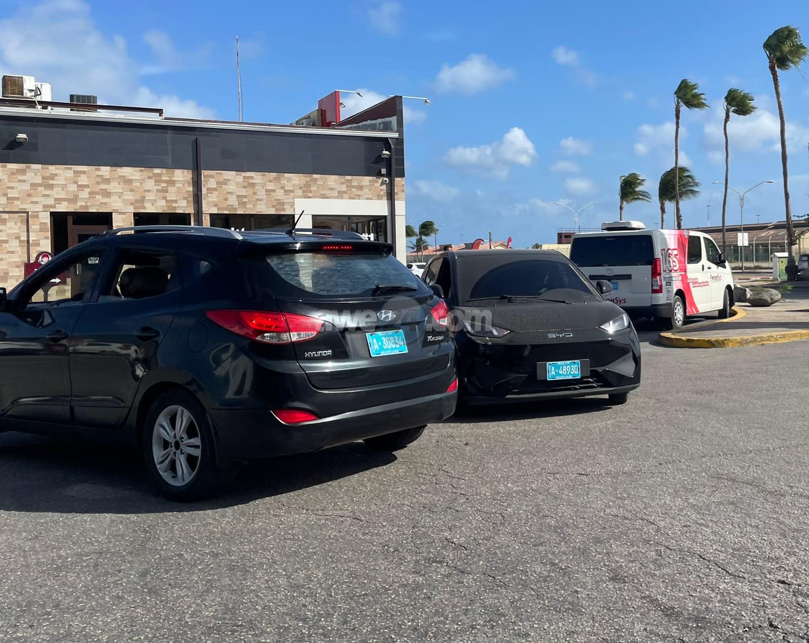 Two Cars Collide Head-On at Fast Food Restaurant Entrance on L.G. Smith Blvd